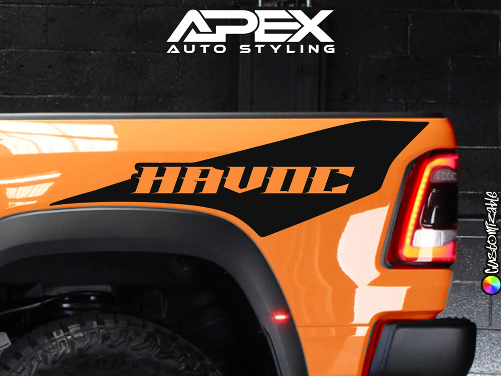 Closeup of orange RAM TRX truck bedside with custom black HAVOC decal, showcasing Apex Auto Styling's Ignition Style graphics replacement for a unique, bold appearance.