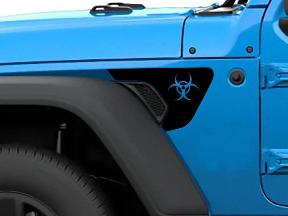 Close-up of a bright blue Jeep Wrangler or Gladiator fender, featuring a black biohazard logo decal on the vent, showcasing the custom vinyl accessory for Jeep vehicles